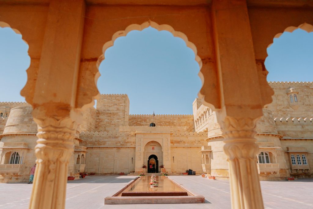 Suryagarh Jaisalmer fort exterior with ornate sandstone arches – luxury destination wedding venue in Rajasthan