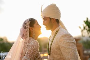 Bride and groom romantic face to face sunset portrait at wedding ceremony Fairmont Jaipur