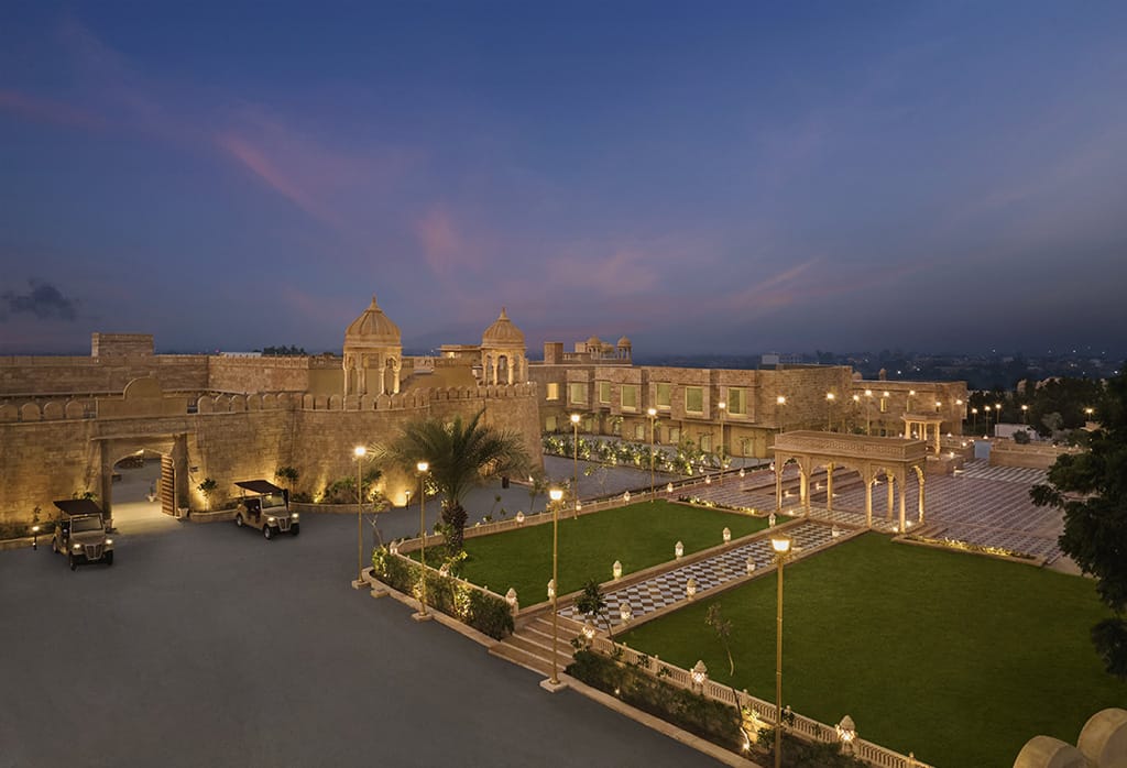 Destination Wedding In Jaisalmer Nighttime exterior of Storii by ITC Hotels Jaisalmer elegantly lit, a heritage hotel perfect for destination weddings in the Golden City of Rajasthan