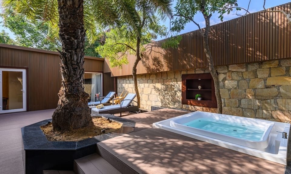 Private villa with a Jacuzzi and sun deck at Ananta Spa & Resort Pushkar, a romantic retreat for couples celebrating their destination wedding in Rajasthan
