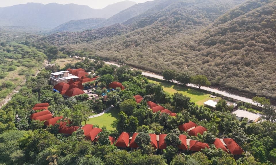 Aerial view of Ananta Spa & Resort Pushkar surrounded by the golden Aravalli hills, one of Rajasthan's finest destination wedding resorts