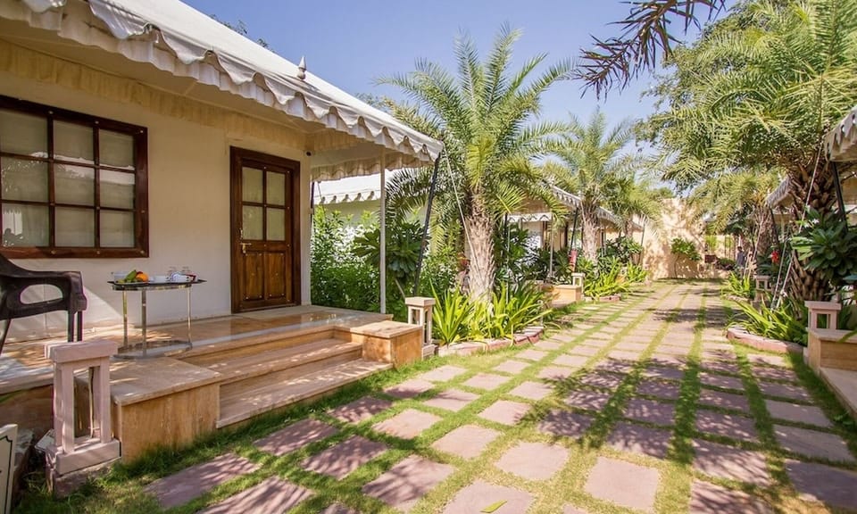 Charming tented cottage with a private balcony at Ananta Spa & Resort Pushkar, offering a unique and intimate stay for destination wedding guests