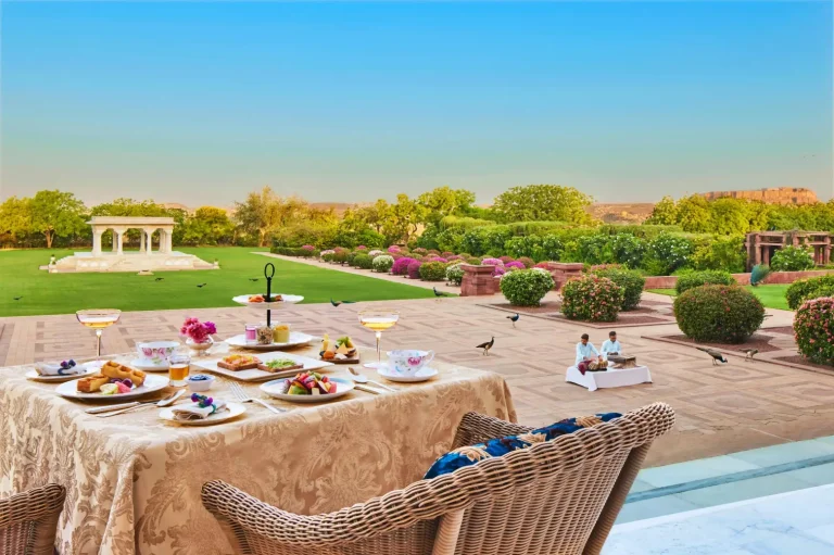 Elegant high tea setup on the manicured lawn at Umaid Bhawan Palace Jodhpur, a classic pre-wedding activity at this iconic royal Rajasthan destination
