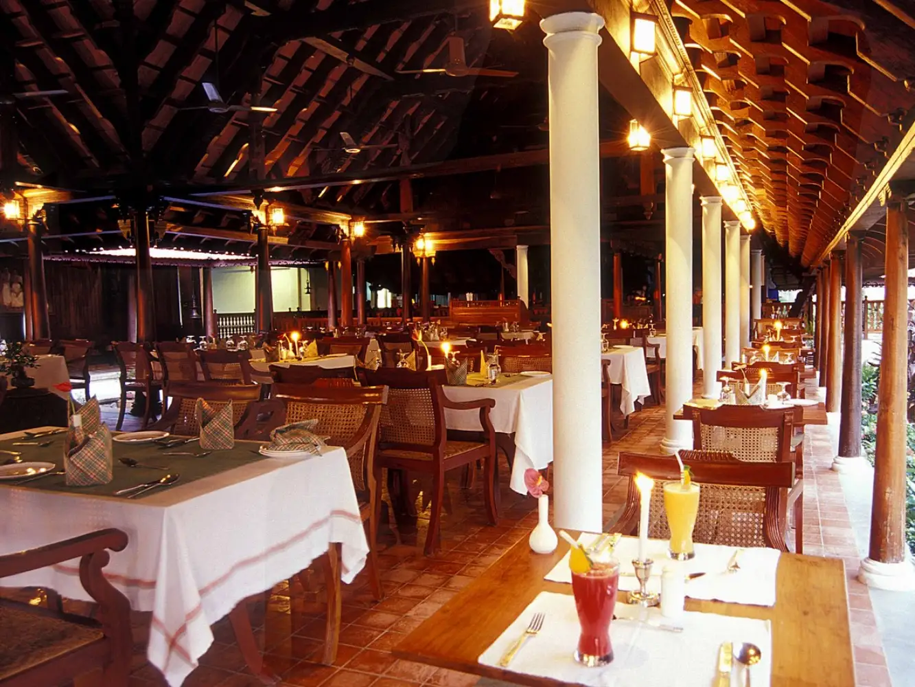 Ettukettu multi-cuisine restaurant with traditional Kerala wood architecture at Kumarakom Lake Resort
