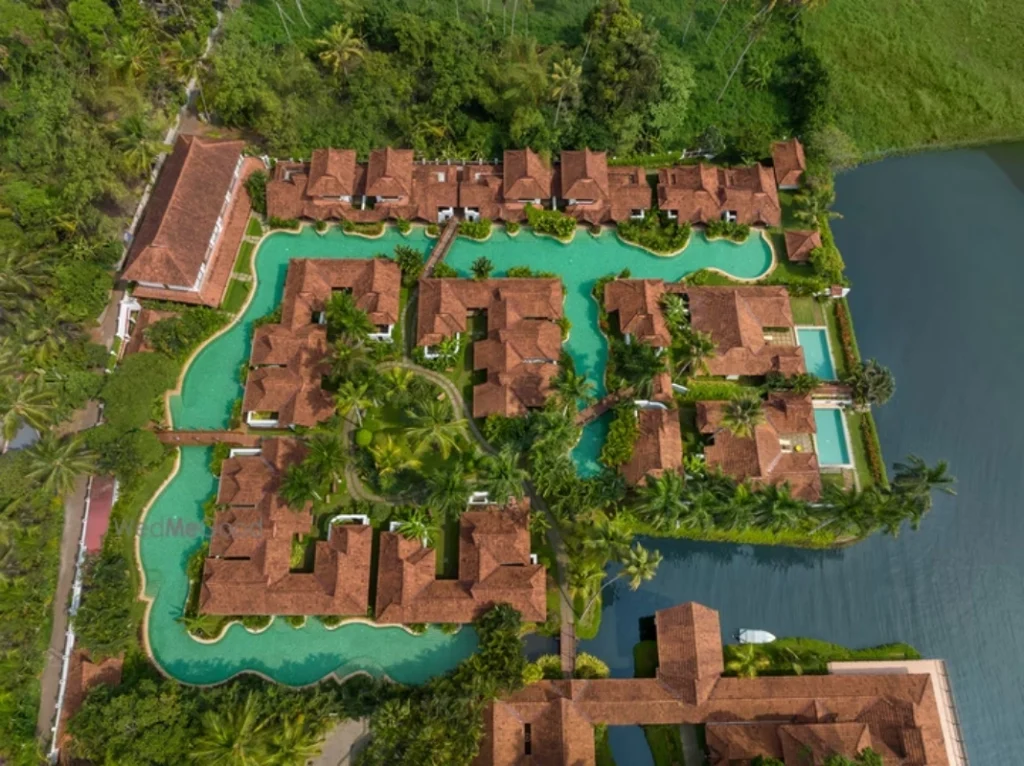 Aerial view of Kumarakom Lake Resort's 250-metre meandering pool and heritage villas