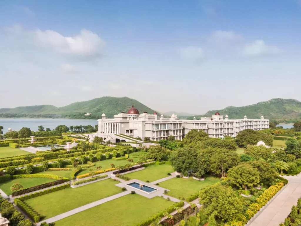 Lakeside facade with domed towers and gardens at Raffles Udaipur