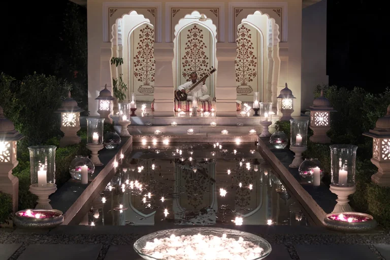Candlelit courtyard with live sitar performance at Rambagh Palace, Jaipur