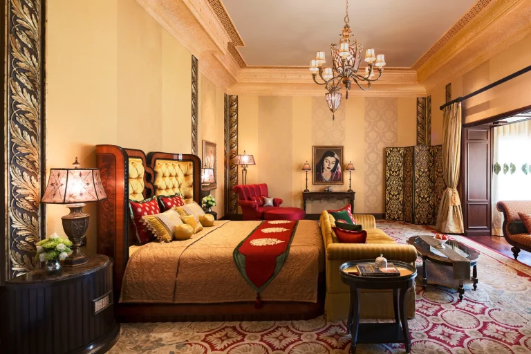 Historical suite with royal portrait and antique furnishings at Rambagh Palace, Jaipur