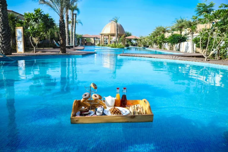Romantic floating breakfast setup for newlyweds at The Westin Resort & Spa Pushkar, a unique honeymoon and post-wedding experience in Rajasthan