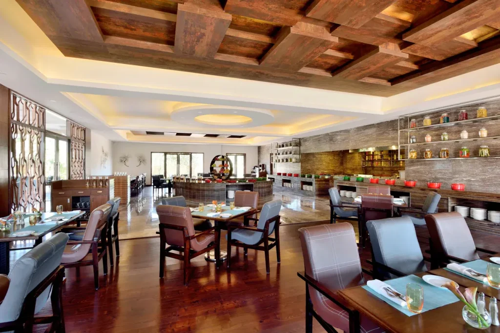 Elegantly decorated indoor banquet hall at The Westin Pushkar set for a royal wedding feast, offering a grand dining experience for destination weddings