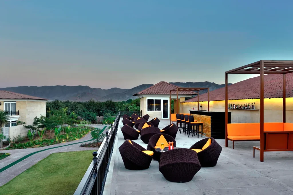 Rooftop cocktail lounge setup at The Westin Resort & Spa Pushkar with sunset views, an ideal pre-wedding cocktail evening venue in Rajasthan