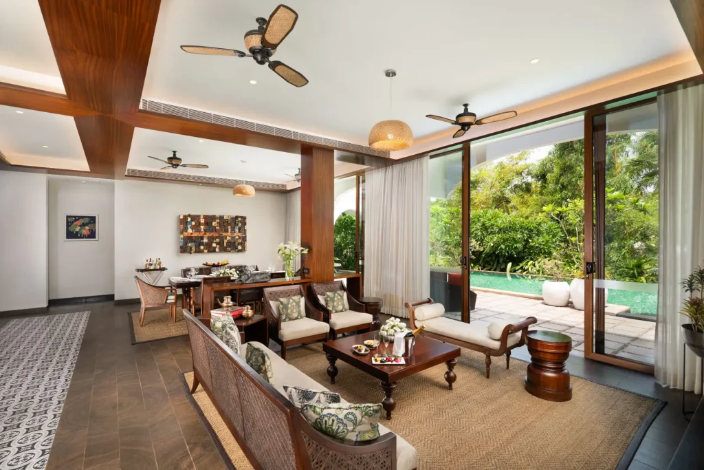 Private pool villa living area with garden view at Taj Bekal Resort & Spa