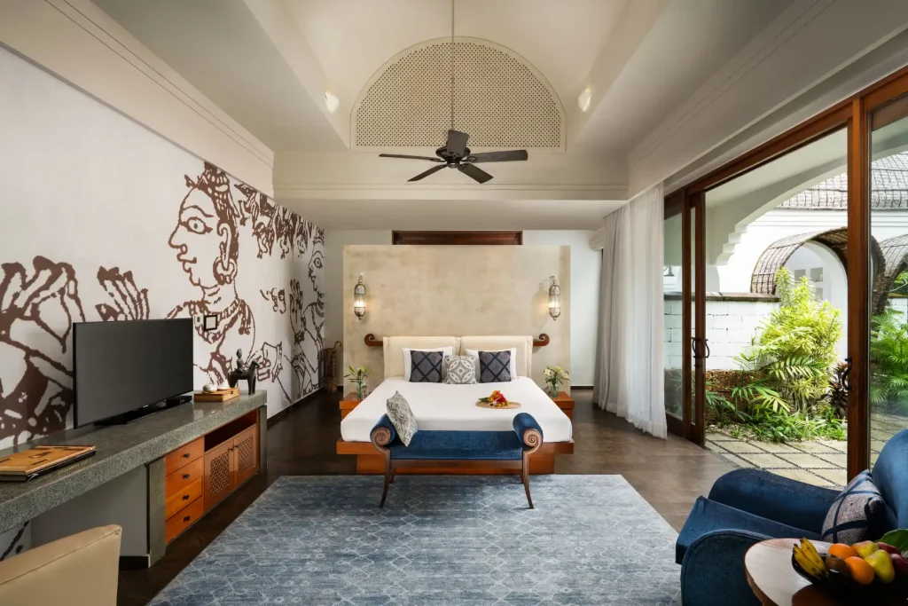 Kerala mural wall art bedroom suite with garden view at Taj Bekal Resort & Spa