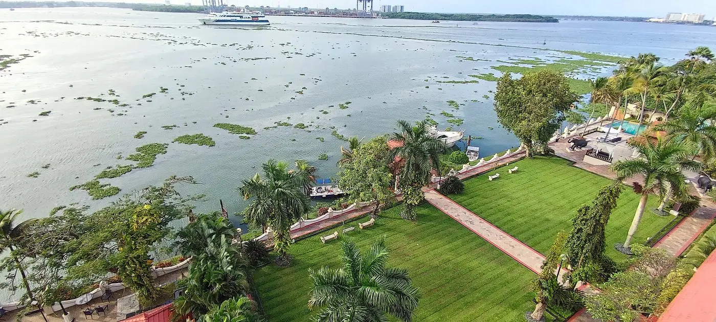 Manicured harbour lawn with backwater panorama for weddings at Taj Malabar Kochi
