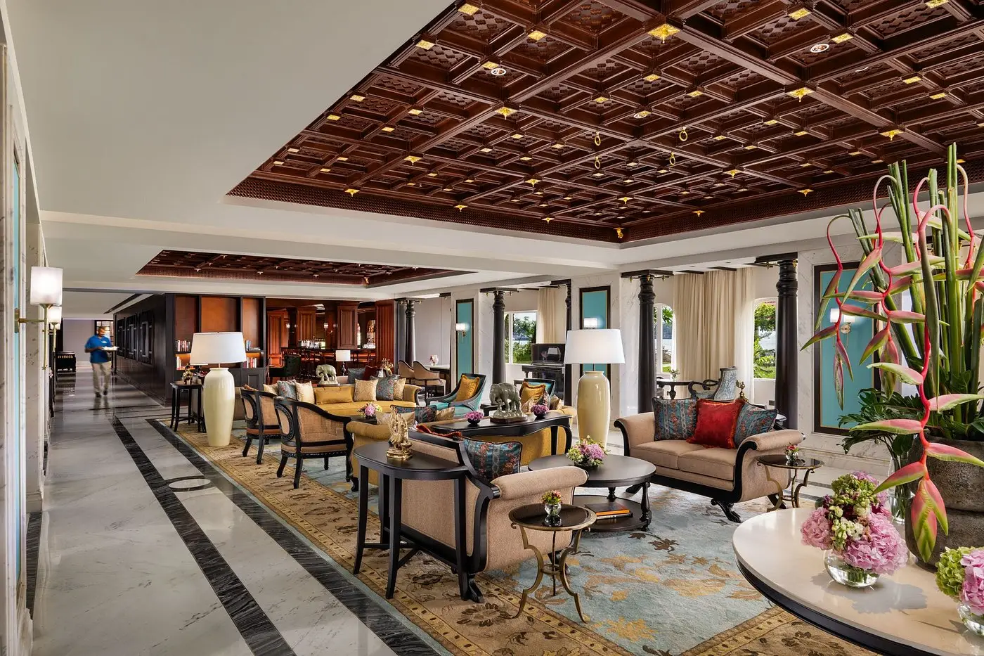Colonial-era grand lobby with carved wooden ceiling at Taj Malabar Resort Kochi