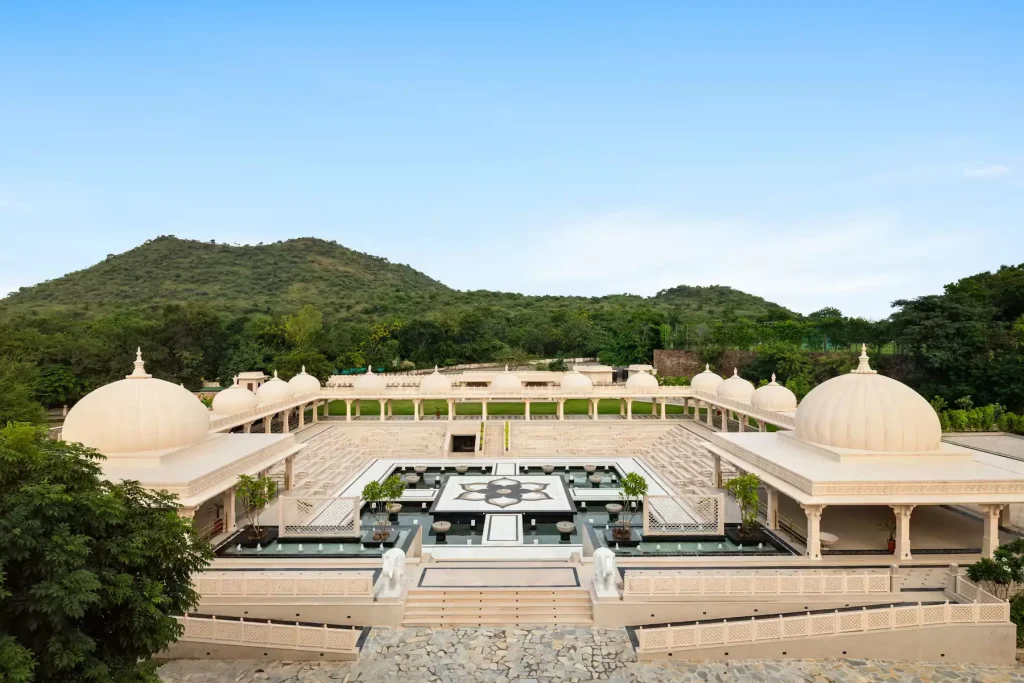 Stepped open-air amphitheater with domed pavilions at Wyndham Grand Udaipur Fatehsagar Lake