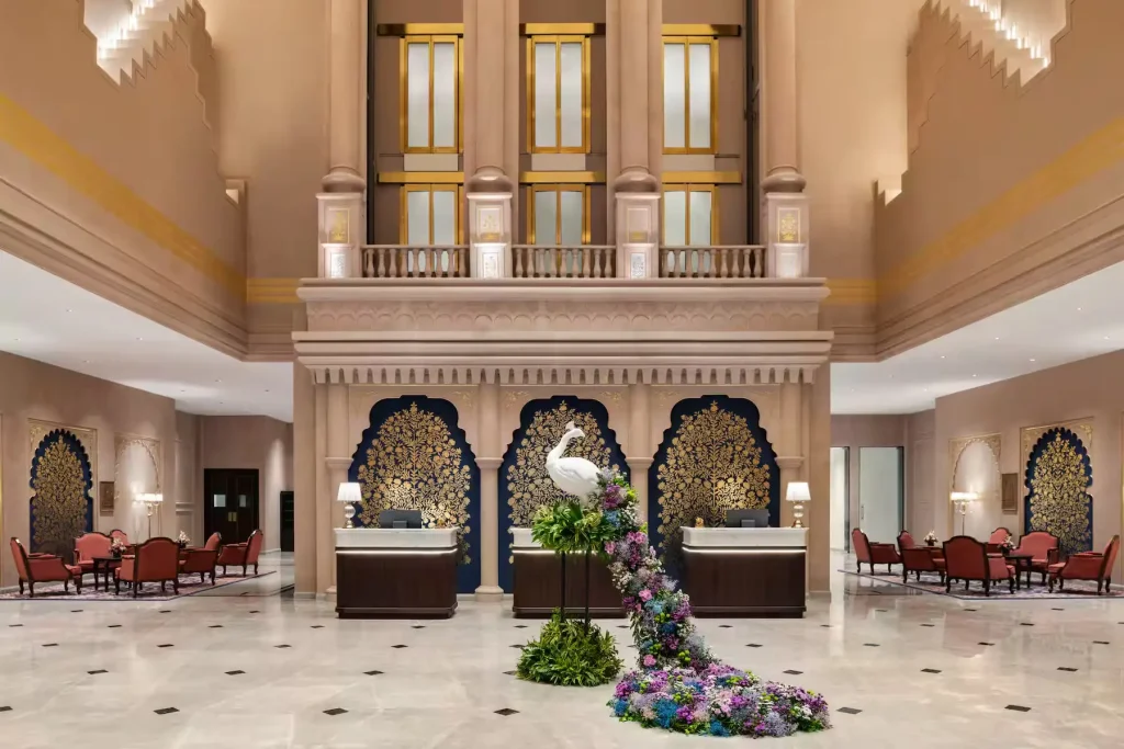 Grand atrium lobby with floral peacock display at Wyndham Grand Udaipur Fatehsagar Lake