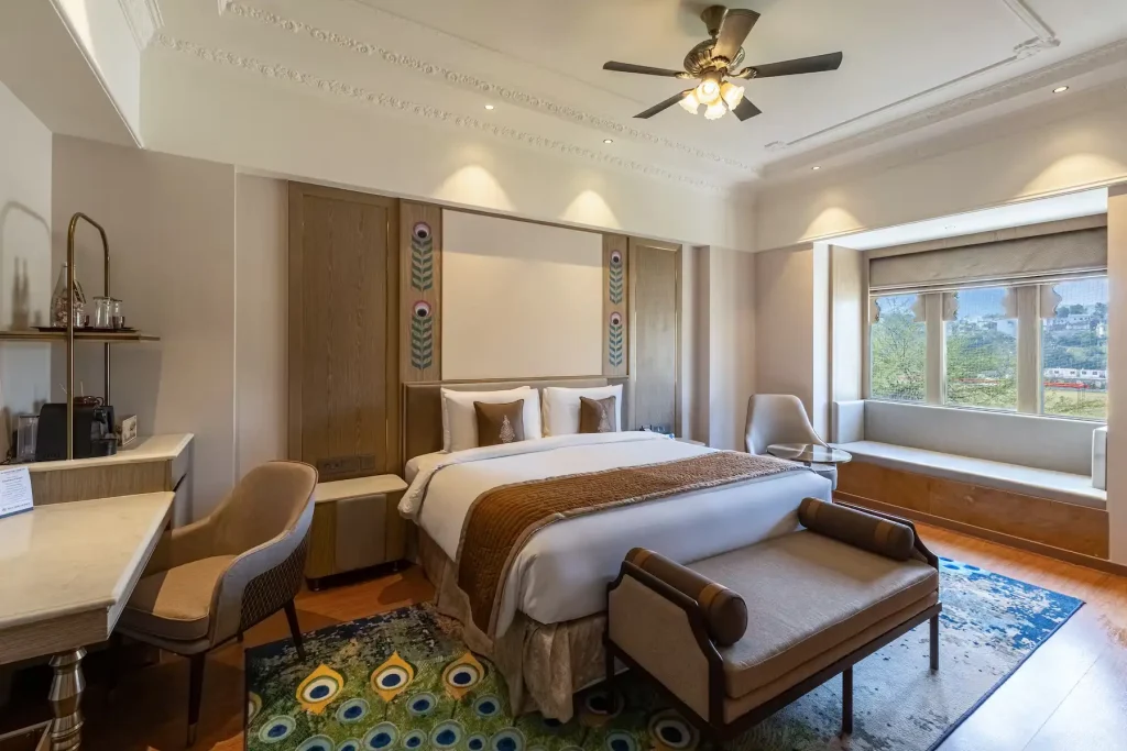 Guest room with peacock motif and hill view at Wyndham Grand Udaipur Fatehsagar Lake
