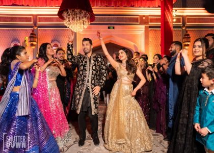 Bride and groom entering dance floor with guests at Sangeet night Fairmont Jaipur