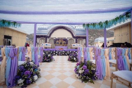 Purple and blue luxury wedding mandap setup at a palace venue in Jaipur, designed by Desert Pearl Weddings for a stunning destination wedding ceremony