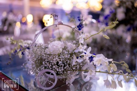 White flower and baby breath centerpiece in decorative cart at Fairmont Jaipur reception