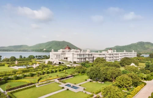 Lakeside facade with domed towers and gardens at Raffles Udaipur