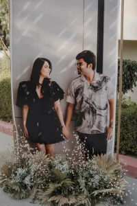 Pre-wedding couple photo standee displayed with dried palm and baby's breath floral arrangement at destination wedding venue, Rajasthan