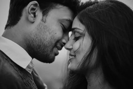 Black and white intimate close-up portrait of couple with foreheads touching and eyes closed at pre-wedding shoot for destination wedding in Rajasthan