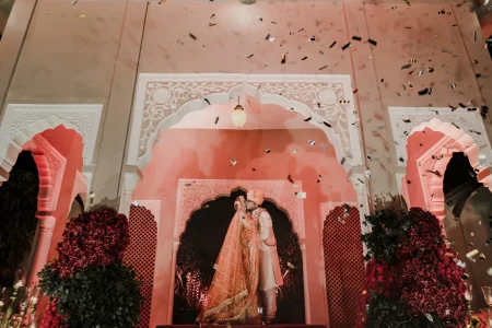 Bride and groom at Rajasthani palace mandap with golden confetti at wedding ceremony, luxury destination wedding in Rajasthan by Desert Pearl Weddings