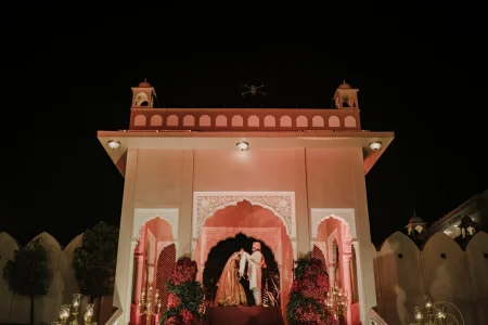 Rajasthani palace wedding mandap lit with rooftop fireworks and pyrotechnics at Nikita and Vedant luxury destination wedding in Rajasthan by Desert Pearl Weddings